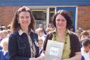 Headteahcer Jean O'Keeffe receives the award from Fiona Firth, Sing Up co-ordinator for Buckinghamshire