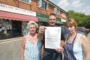 Letter: Fellow shopkeepers Marlene Hufflett and Savica Basaric with Bernie Longhurst, centre, holding the letter from Thames Water