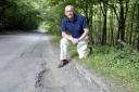 Derek Dickenson and the pothole in Penn Bottom