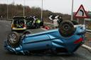 The men had to be rescued after their car flipped onto its roof