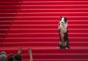 Messi the dog poses for photographers upon arrival at the awards ceremony and the premiere of the film The Second Act during the 77th international film festival in Cannes, southern France (Andreea Alexandru/Invision/AP)