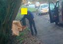 Fly-tipper caught on camera dumping carboard near busy road