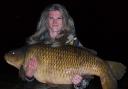 Woman catches record-breaking 'giant' carp at Bucks fishery