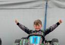 Young Ralph celebrates finishing first in the race in Northampton