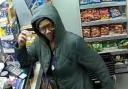 Police release CCTV image after assault and racial abuse of staff at corner shop