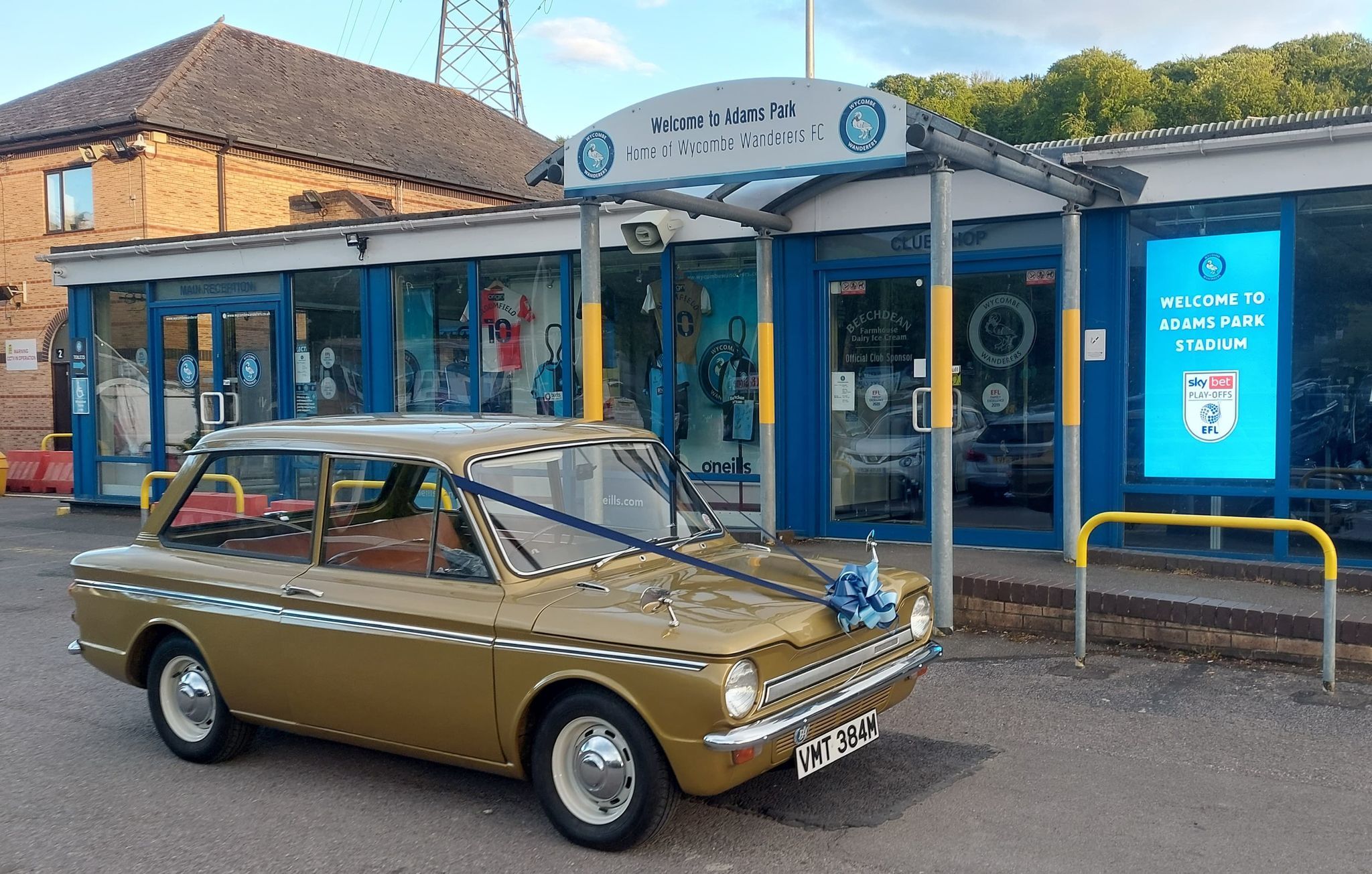 A 1974 Hillman Imp with light and dark blue ribbons was seen outside Adams Park on the day of final 
