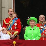 Queen Elizabeth II joining members of the royal family, including the Duke and Duchess of Cambridge with their children Princess Charlotte and Prince George, on the balcony of Buckingham Palace (PA)