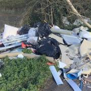 Fly-tipper fined hundreds after household waste found in bus stop
