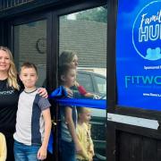 Kimberly Parker (pictured with her two children at the grand opening on September 16) is the owner and founder of the Family Hub