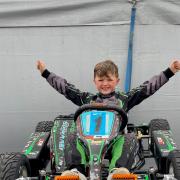Young Ralph celebrates finishing first in the race in Northampton