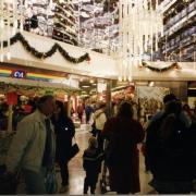 Looking E towards C and A's store, a busy Christmas shopping scene in the Chiltern Centre, off Frogmoor, High Wycombe. c1990