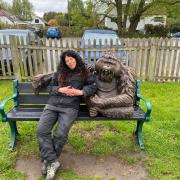 Casey Nadine Banwell, sat with Long Arm the Orangutan sculpture of Leuser the blind Orangutan