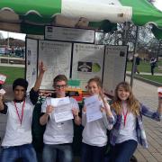 Salima-Lina Zaher, Asim Asghar, Jacob Burridge, Eleanor Jones and Charlotte Rumsey, in front of their stall with the certificates.