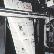 The paper is folded on the press
