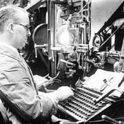 A worker using a Linotype machine in 1937