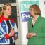 Mrs May, right, speaking with Paralympic rowing gold medallist Naomi Riches, left., at Marlow Rowing Club on Friday. Mrs May brushed off the leadership speculation when asked by the BFP at the event