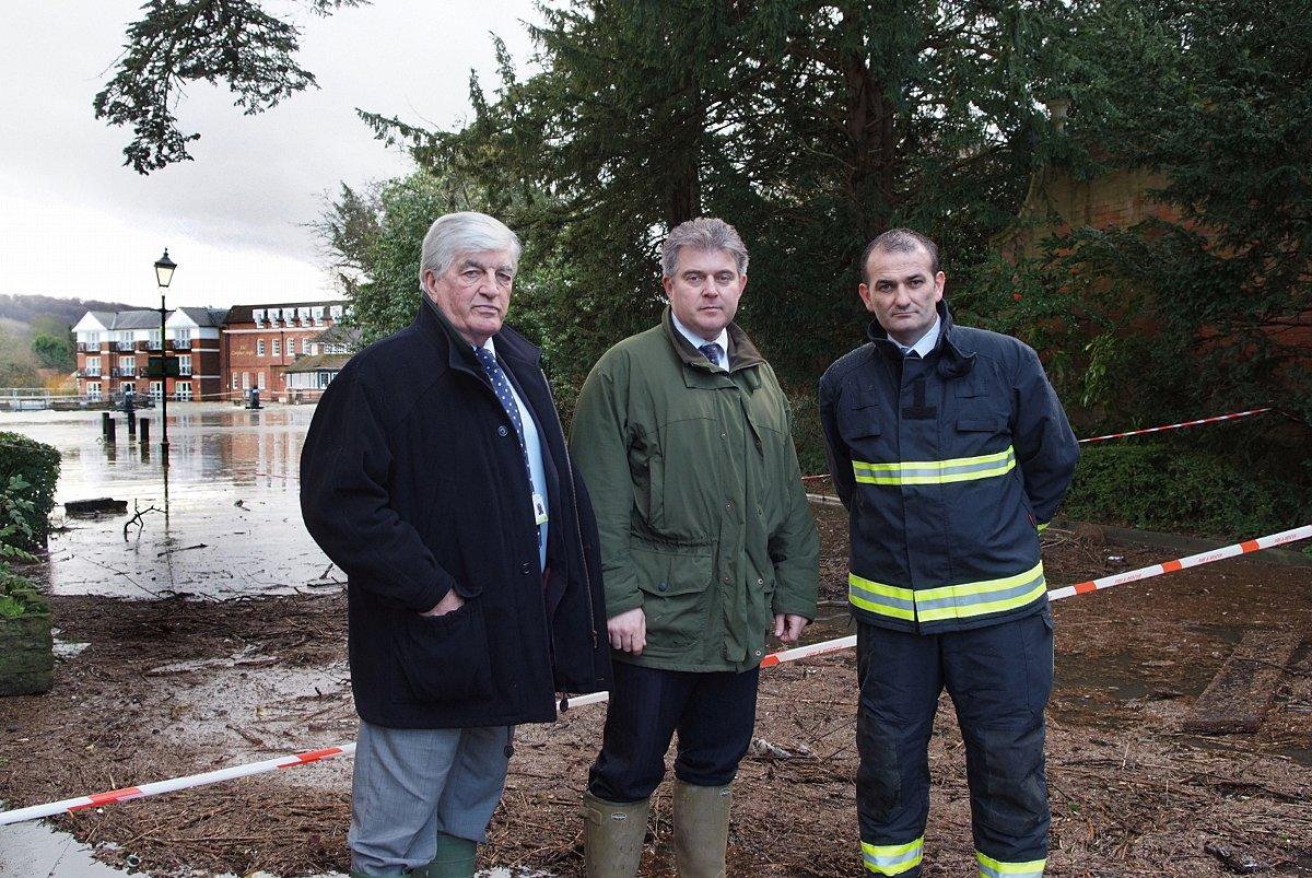 Wycombe District Council leader Richard Scott with minister Brandon Lewis and firefighters in Marlow. Picture by Ann Priest