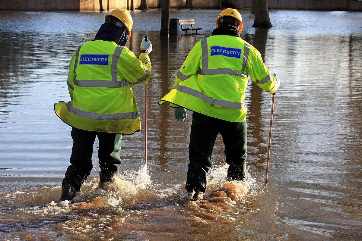 Electricity engineers were forced to wade through floodwater to inspect power supplies in Higginson Park, Marlow.