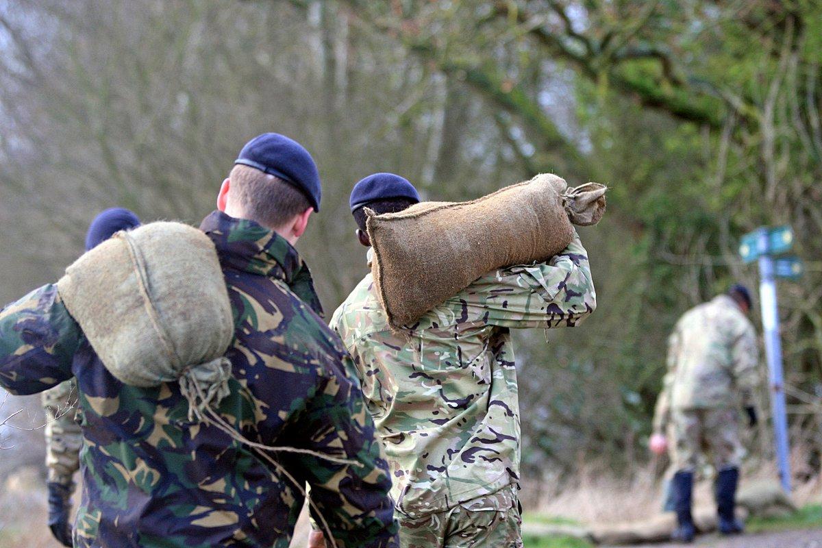 Troops descend on Cookham to lay sandbags to protect the village from more flooding.
