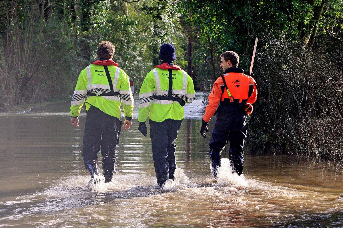 Troops arrive in Ferry Lane, Medmenham, where residents are forced to wade through the road