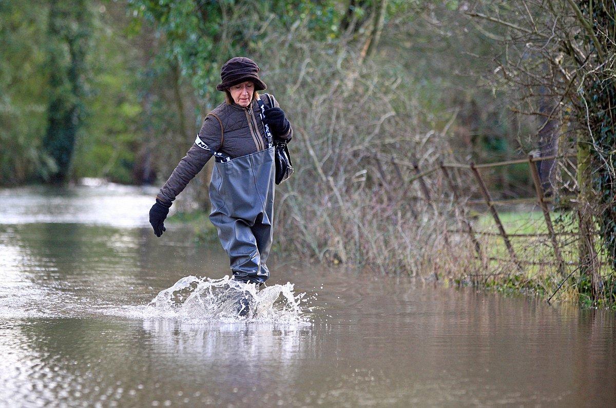 Troops arrive in Ferry Lane, Medmenham, where residents are forced to wade through the road