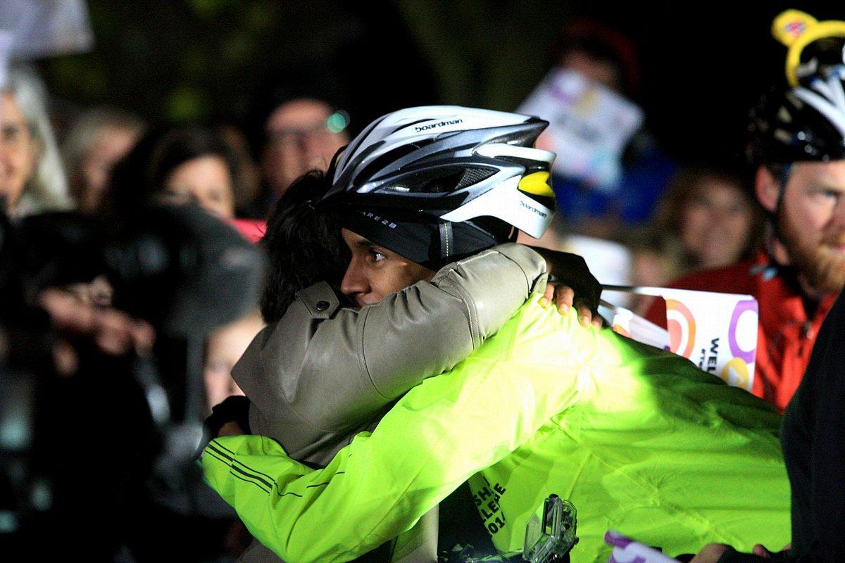 Heartfelt embraces greet Alex's achievement.
