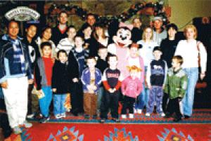 Minnie magic: The group of children accompanied by their families join in the fun with Minnie Mouse at Euro Disney