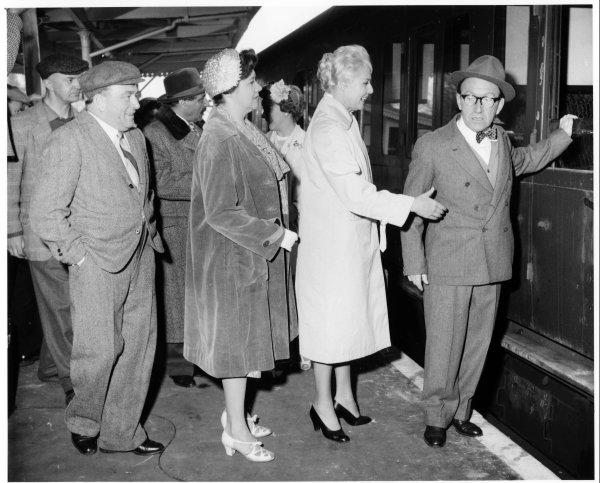 Comedian Arthur Askey about to board the Marlow Donkey accompanied by a party of men and women at the railway station, Bourne End, April 1959