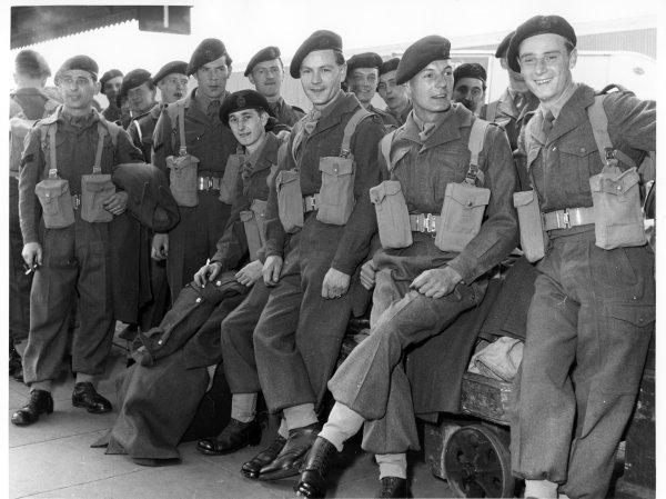 Territorial Soldiers waiting for their train to take them to camp. Railway Station, High Wycombe. May 1954