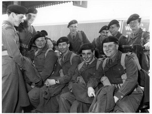 Territorial Soldiers waiting for their train to take them to camp. Railway Station, High Wycombe. May 1954