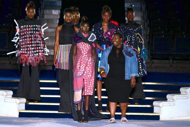 Nyasha Mabhunu (centre) with models wearing her designs on the catwalk