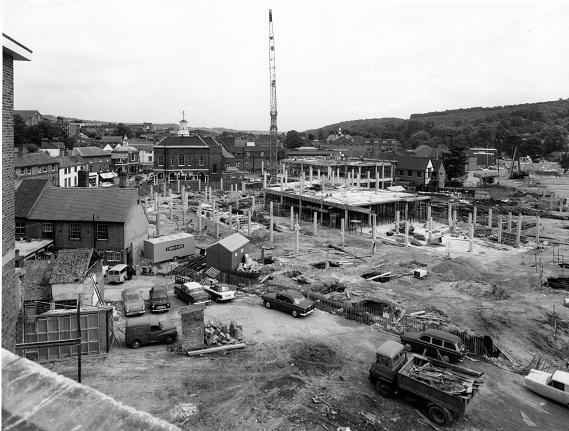 During the early stages of the construction of the Octagon shopping centre, from the roof of Murrays store, High Wycombe. The Guildhall is to the left of the crane-jib