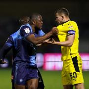 Could Uche Ikpeazu (pictured squaring up to Michal Helik of then, Barnsley, in March 2021), re-join Wycombe this January Transfer Window?