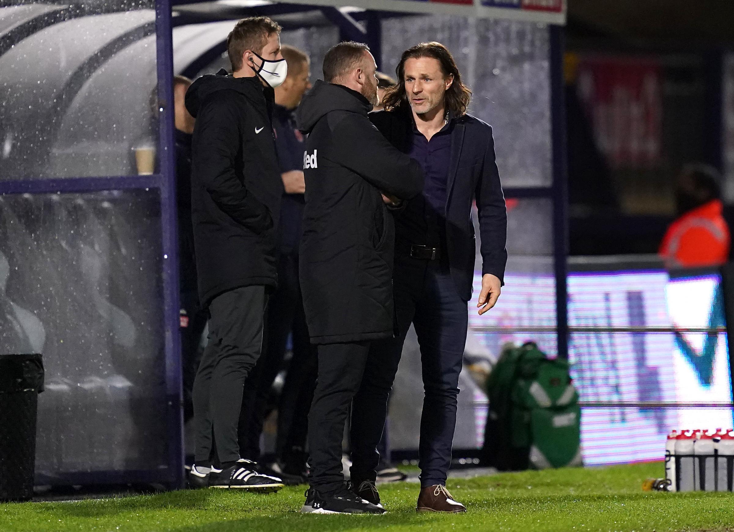 Gareth Ainsworth is currently at 6/4 to take over at Preston North End. Here he is talking to Wayne Rooney when Derby visited Adams Park in February (PA)