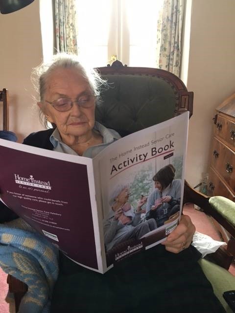 Resident, Jane. enjoying her activity book