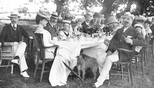 RHW50753 These well-to-do people are enjoying a more formal picnic held on Monkey Island, the river Thames near Maidenhead, c1930.