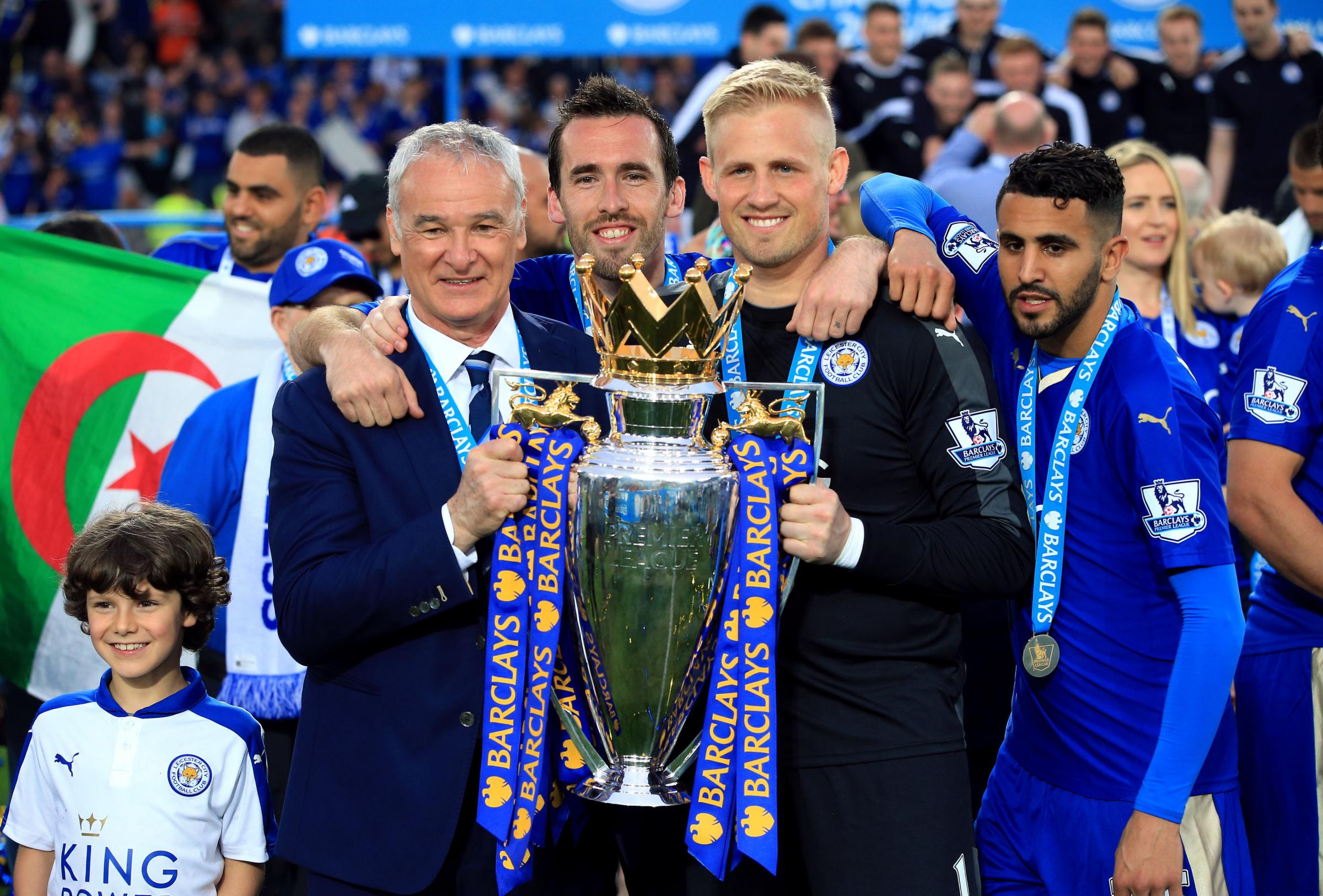 Then Leicester City manager Claudio Ranieri (left), Christian Fuchs (centre), Kasper Schmeichel and Riyad Mahrez (right) with the PL trophy in May 2016. A year earlier, under Nigel Pearson, the club avoided relegation over winning seven of their last