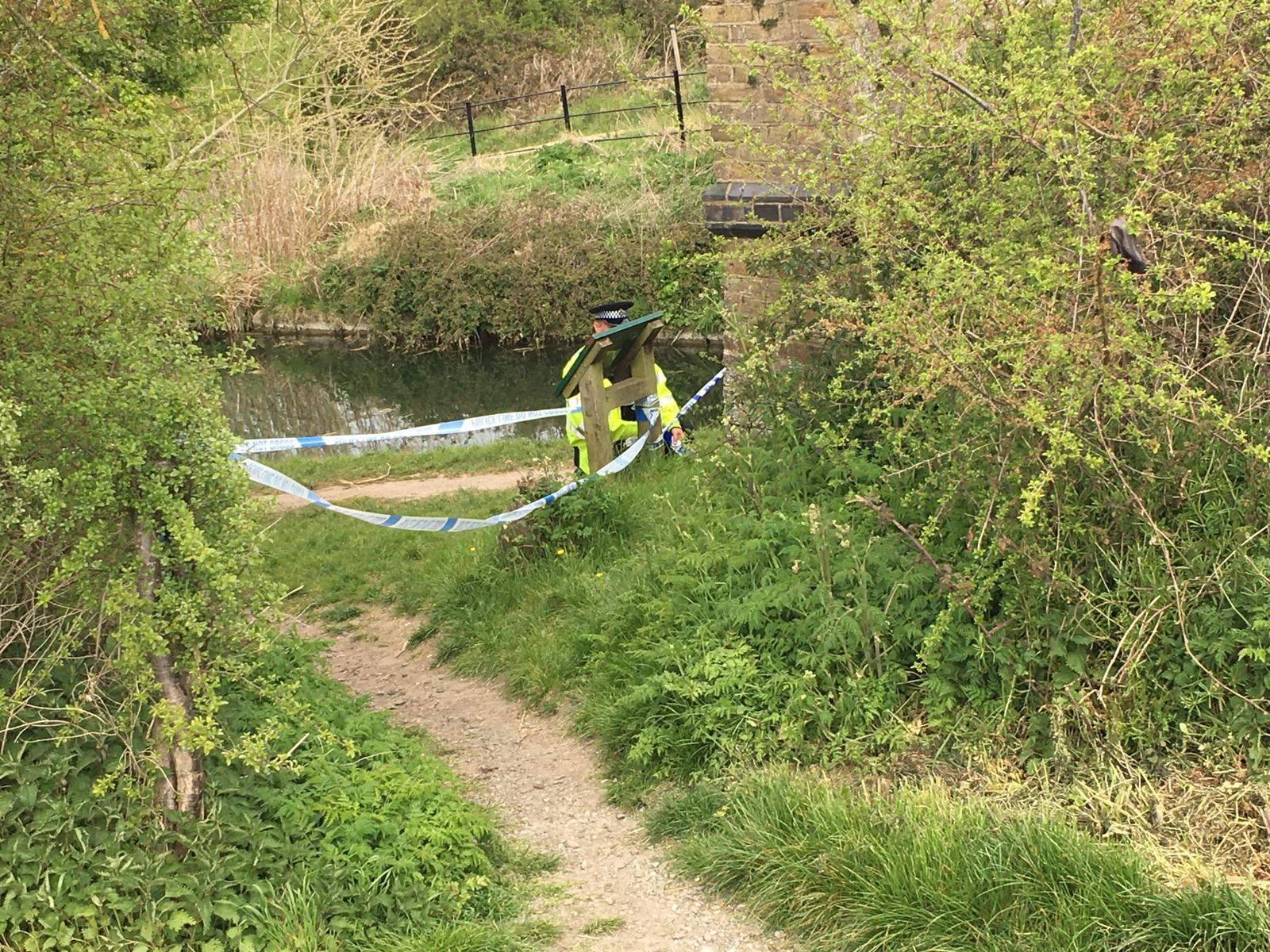 Police were seen taping off parts of the path near the canal