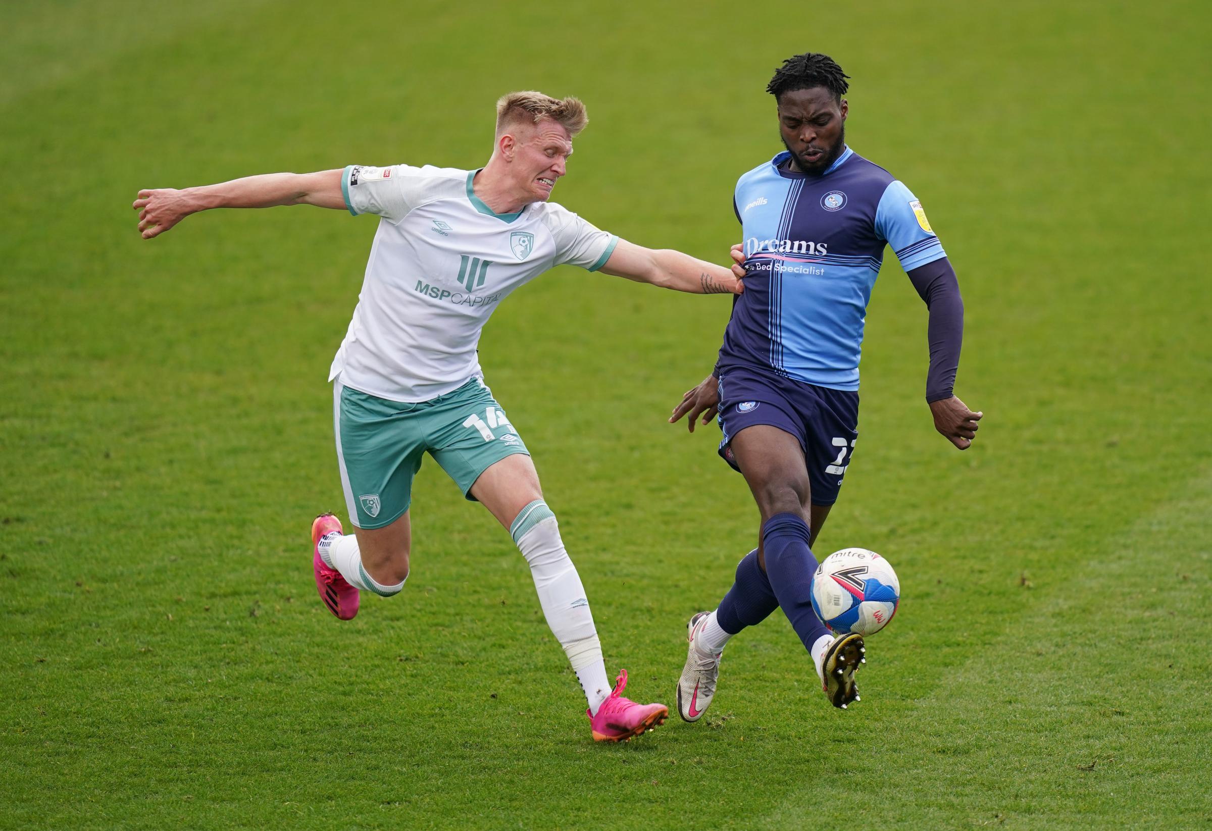 Fred Onyedinma gets past Sam Surridge during the 1-0 win at Adams Park (PA)
