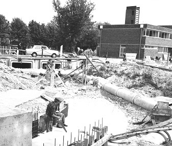 The twin culvert to carry the river Wye is under construction in the St Mary St area in May 1965. The Fire Station can be seen in the background to the right