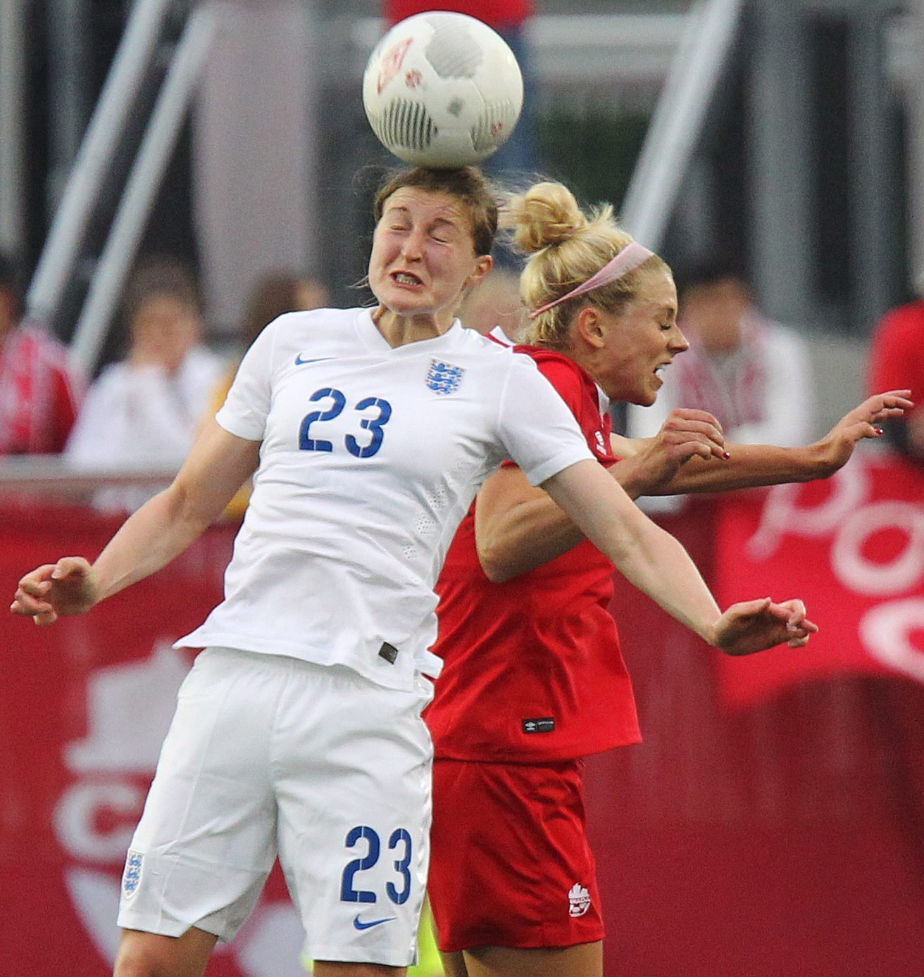Englands Ellen White, left, heads the ball in front of Canadas Lauren Sesselmann during a womens international soccer friendly match in Hamilton, Ontario, Canada on Friday May 29, 2015. (Dave Chidley/The Canadian Press via AP) 
