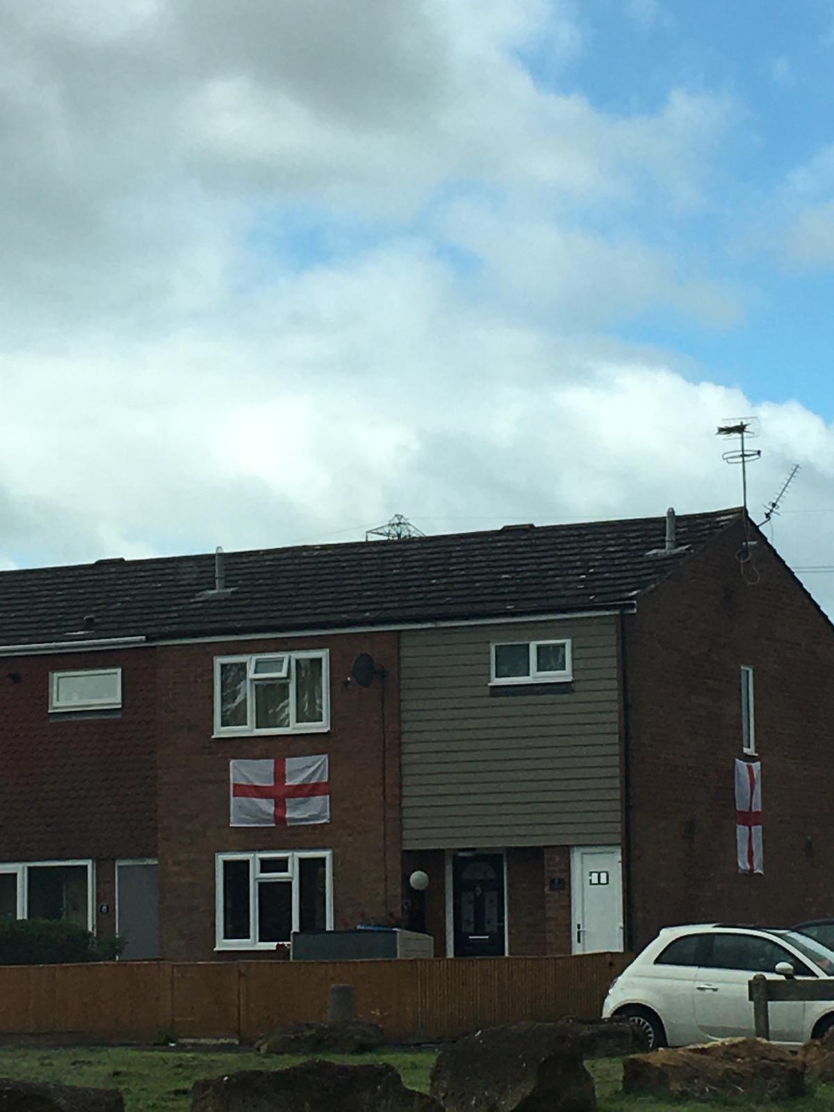 Two flags are seen in Cornbrook Road in Aylesbury