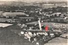 Aerial photo of Amersham-on-the-Hill in 1919. The station is marked with a red arrow. Chesham Bois is towards the top of the photo
