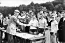 Mr G A Hart, the Secretary of the High Wycombe Youth Organisations Committee, presents trophies to a girls’ relay team who were one of the winners in the Youth Sports Day held on the Rye in June 1958.