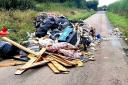 Road closes after 'huge' fly-tip is discovered