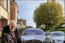 Luxury car enthusiast, Bryan, in front a Rolls-Royce