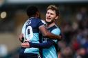 Bez Lubala (left) scored his first goal for Wycombe in their 2-0 win over Cheltenham