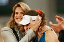French Open director Amelie Mauresmo, left, hugs an emotional Alize Cornet (Jean-Francois Badias/AP)