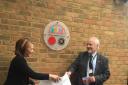 Jo Walden and Cllr Noel Brown unveil the plaque at the college