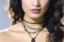 Go for smokey eyes and pale lips for a dramatic party look. Cross necklace, 7.99, from River Island